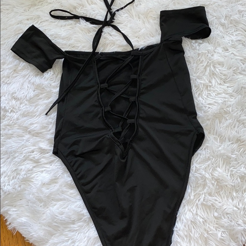 Black open back one piece